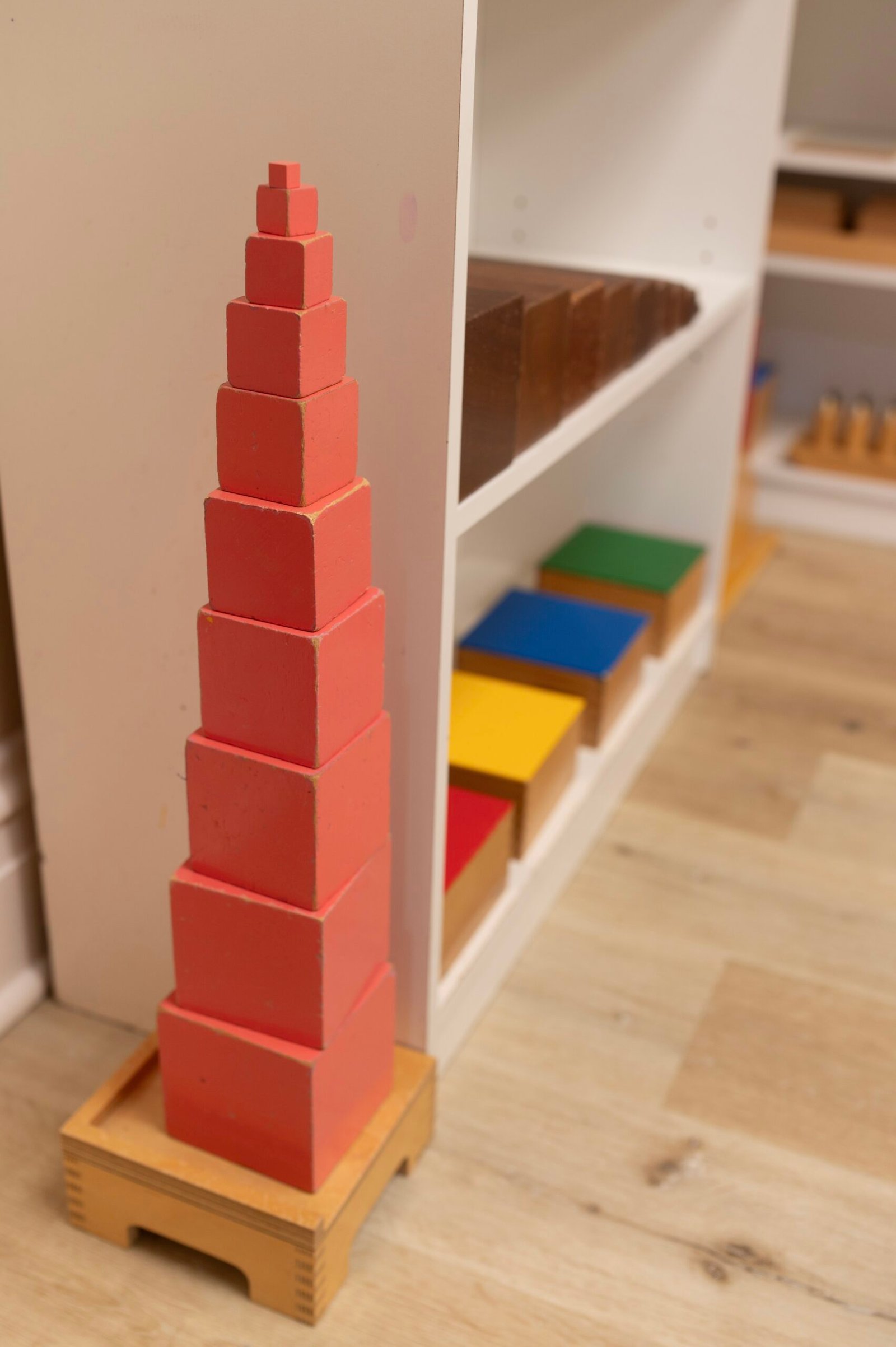 Classic Montessori sensorial materials including pink tower, brown stair, and red rods at W Montessori Academy